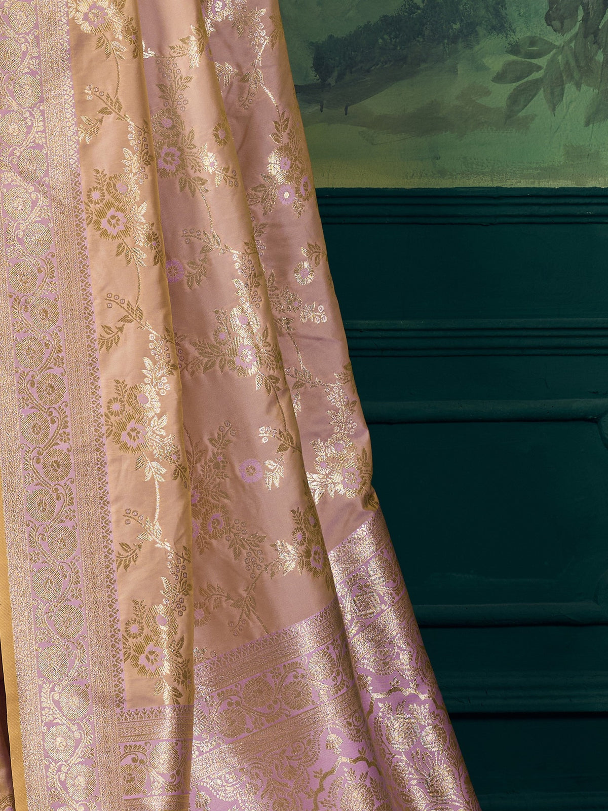 Pallu detail of rose gold banarasi silk saree showing woven motif design and zari border