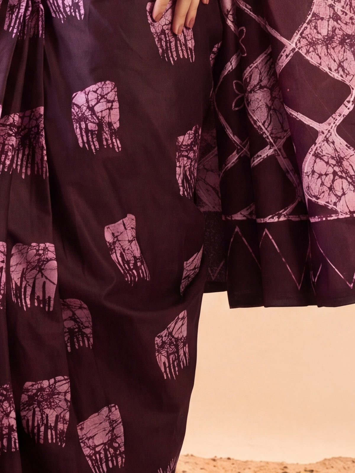 Pallu detail of burgundy cotton saree showing bagru hand block-print work and printed border
