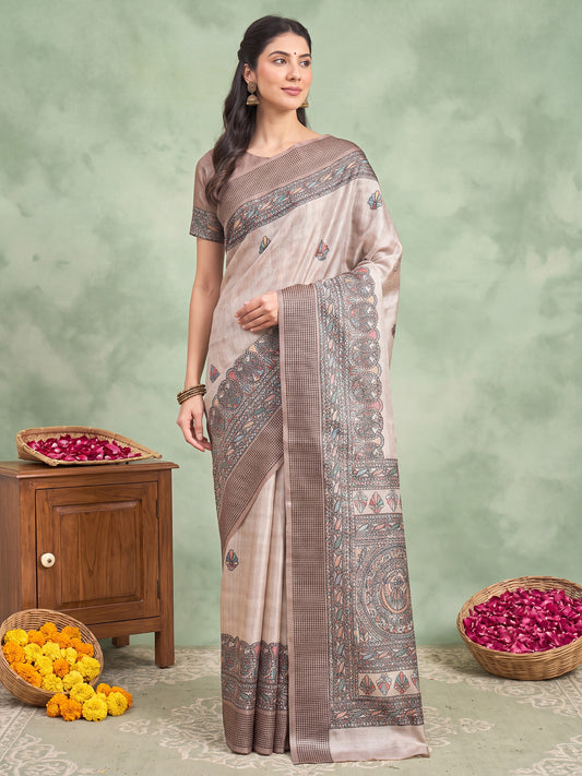 Woman wearing beige manipuri silk saree with madhubani folk-art motifs and beige blouse