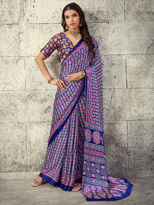 Woman wearing navy blue satin saree with ajrak block-print motif work and rust blouse