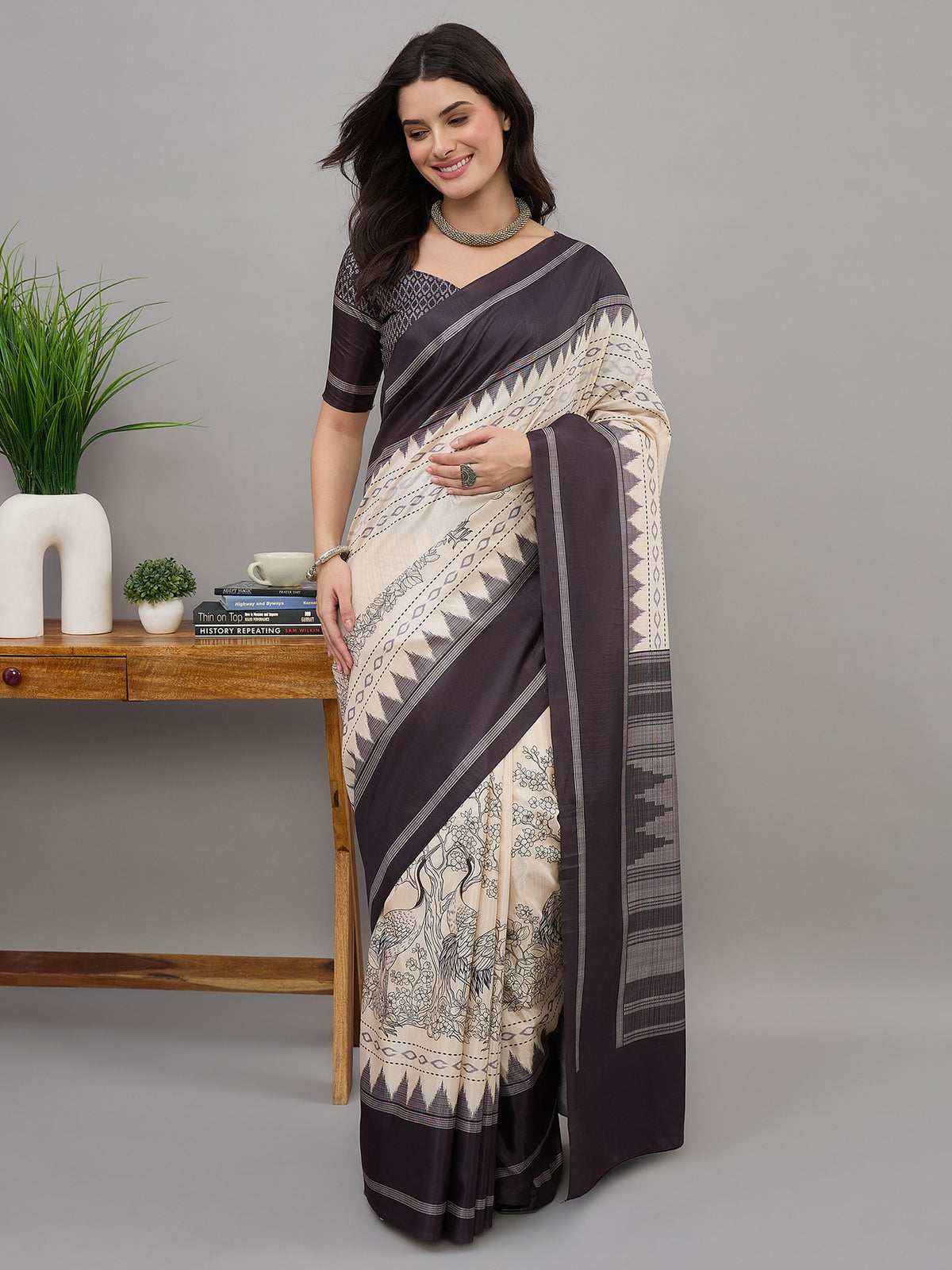 Off White ethnic motif soft silk saree with black blouse piece