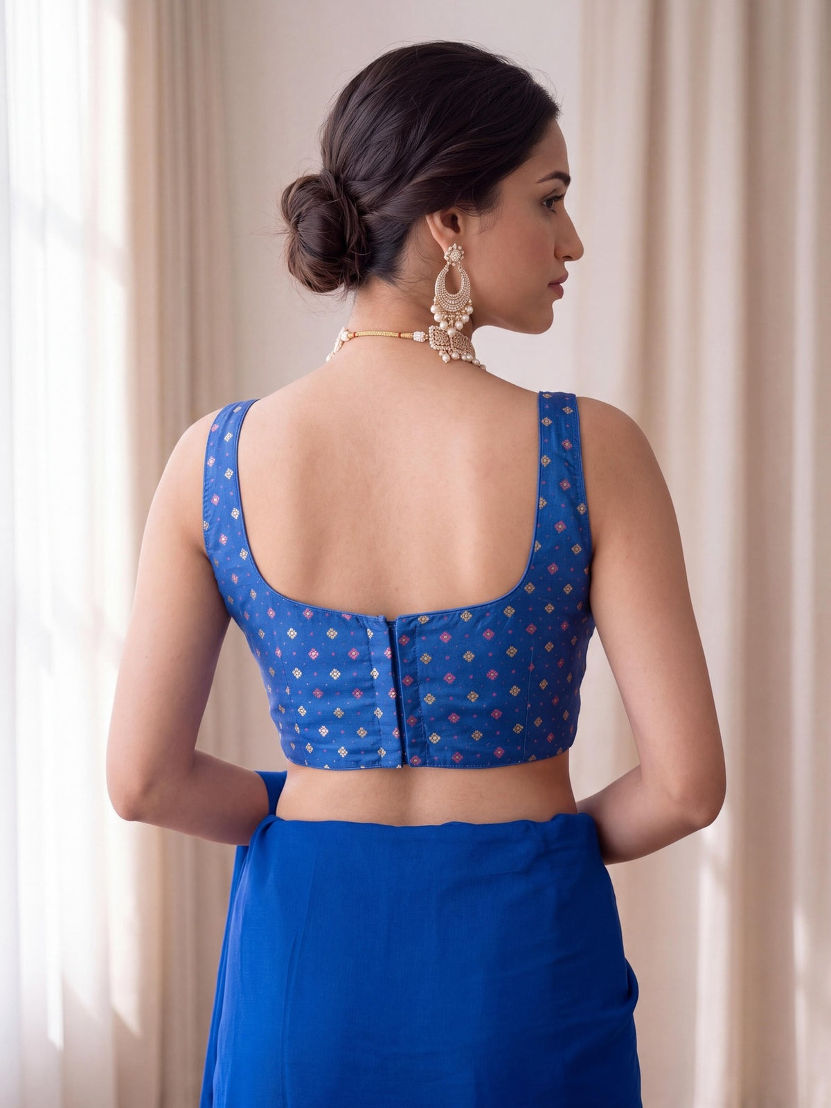 Turquoise Blue zari woven silk blend sleeveless readymade saree blouse with round neck view 3