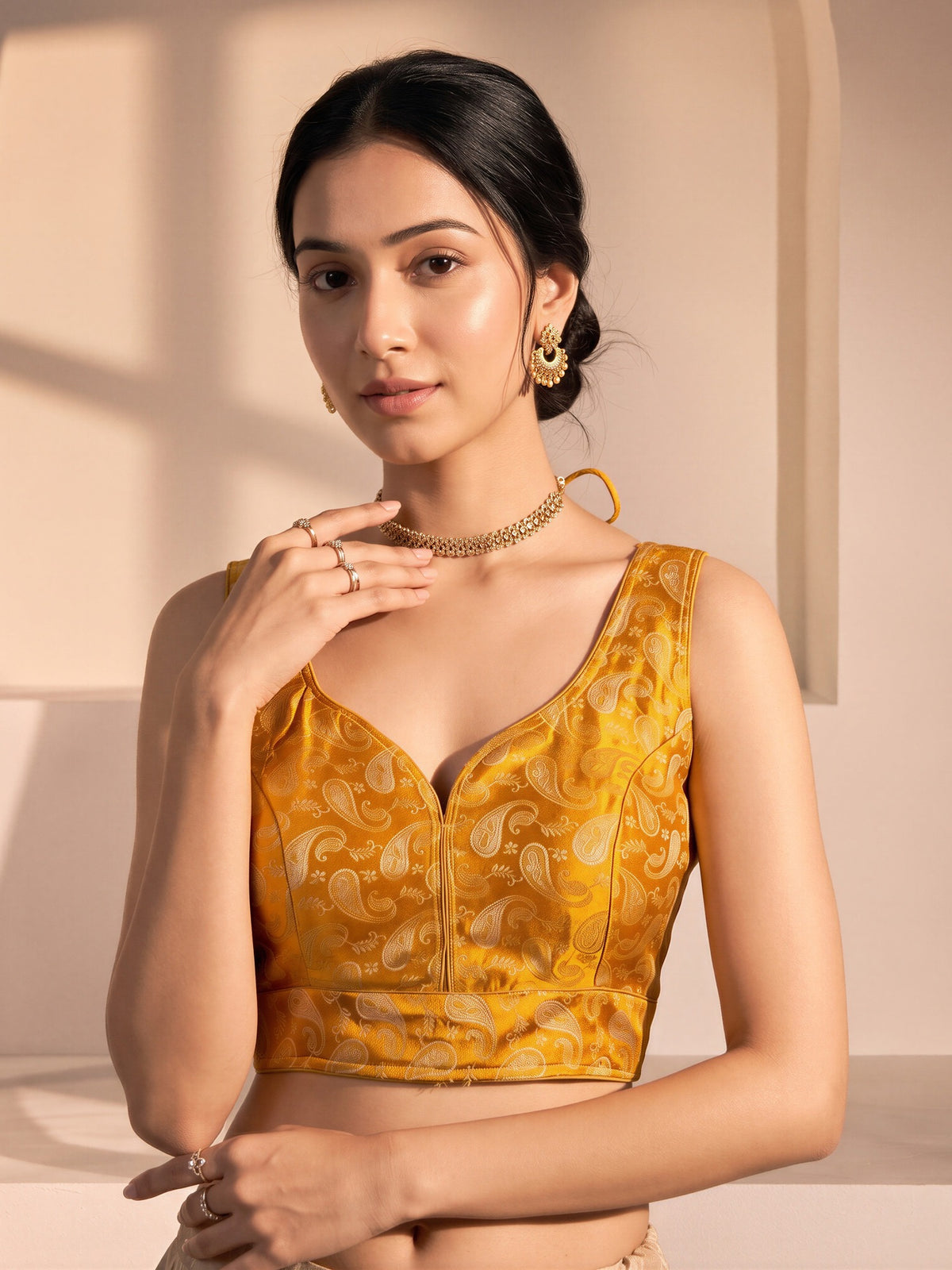 Orange woven brocade silk blend sleeveless readymade saree blouse with v neck