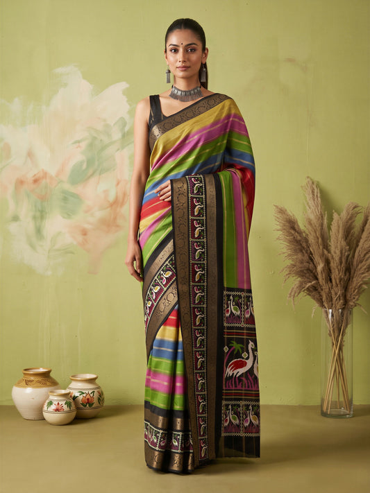 Woman wearing multicolored dola silk saree with traditional indian motif work and black blouse