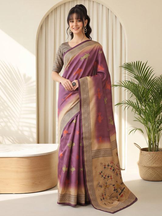 Woman wearing mauve silk blend saree with tribal folk-art motifs and beige blouse