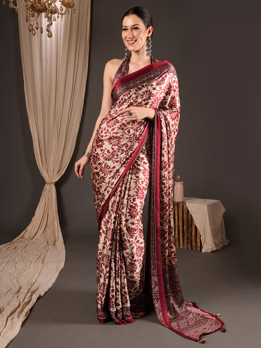Woman wearing cream satin saree with ajrak block-print motif work and maroon blouse
