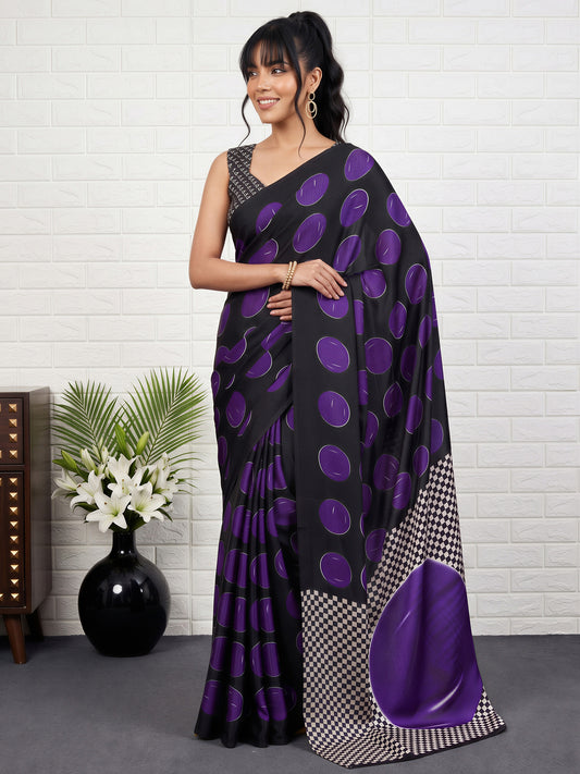 Woman wearing purple satin saree with traditional indian motif work and black blouse