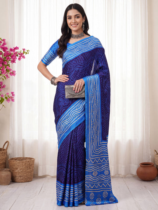 Woman wearing navy blue satin silk saree with bandhani tie-dye dot work and light blue blouse