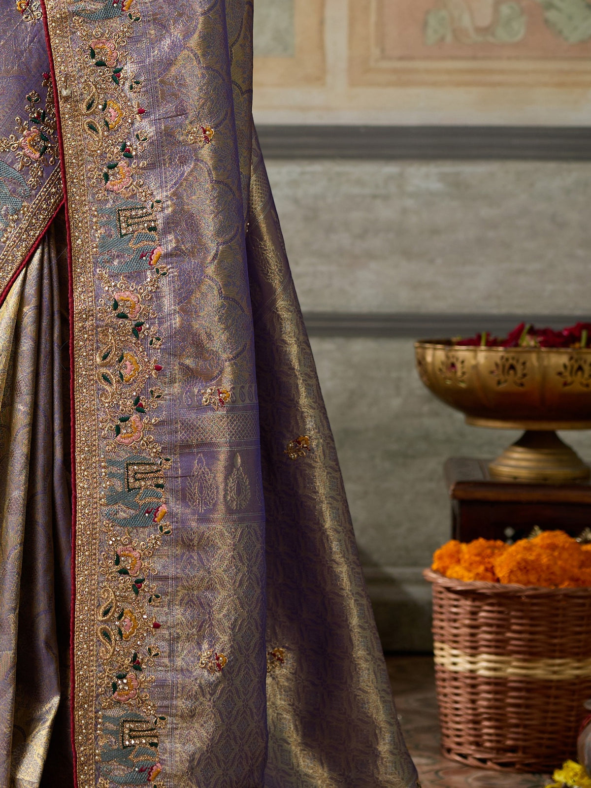 Pallu detail of lavender silk blend saree showing ornamented surface design and embellished border