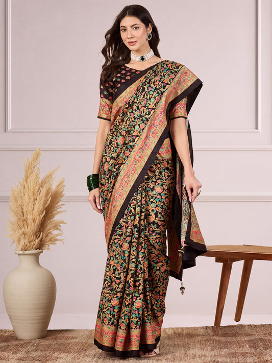 Woman wearing black dola silk saree with traditional indian motif work and black blouse