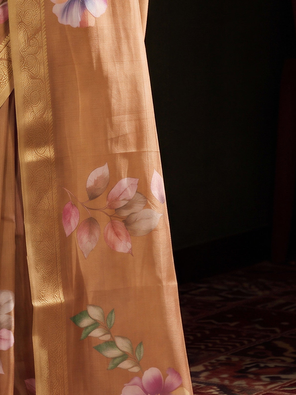 Pallu detail of light brown silk blend saree showing all-over floral design and zari border