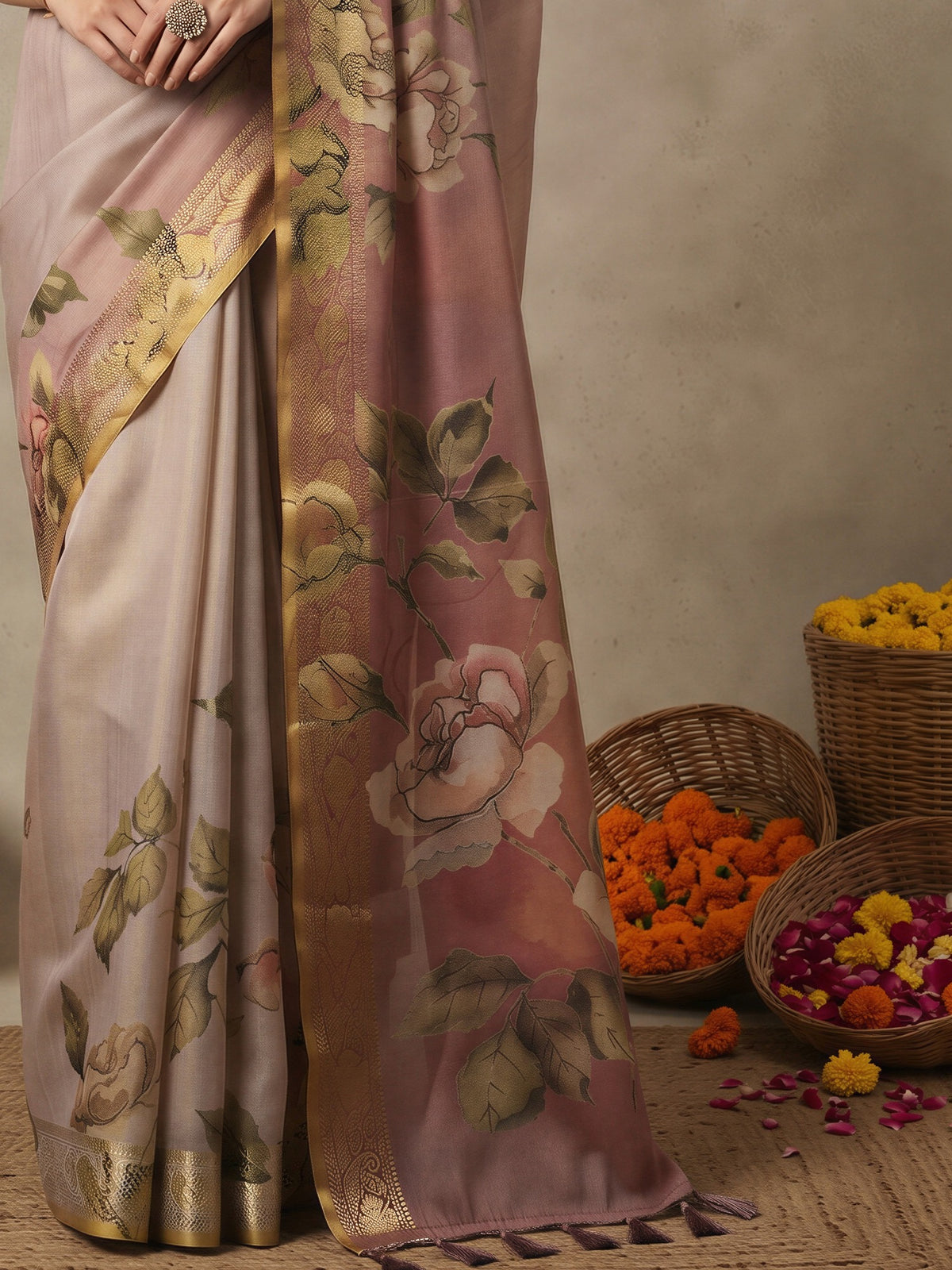 Pallu detail of beige kanjeevaram silk saree showing all-over floral design and zari border