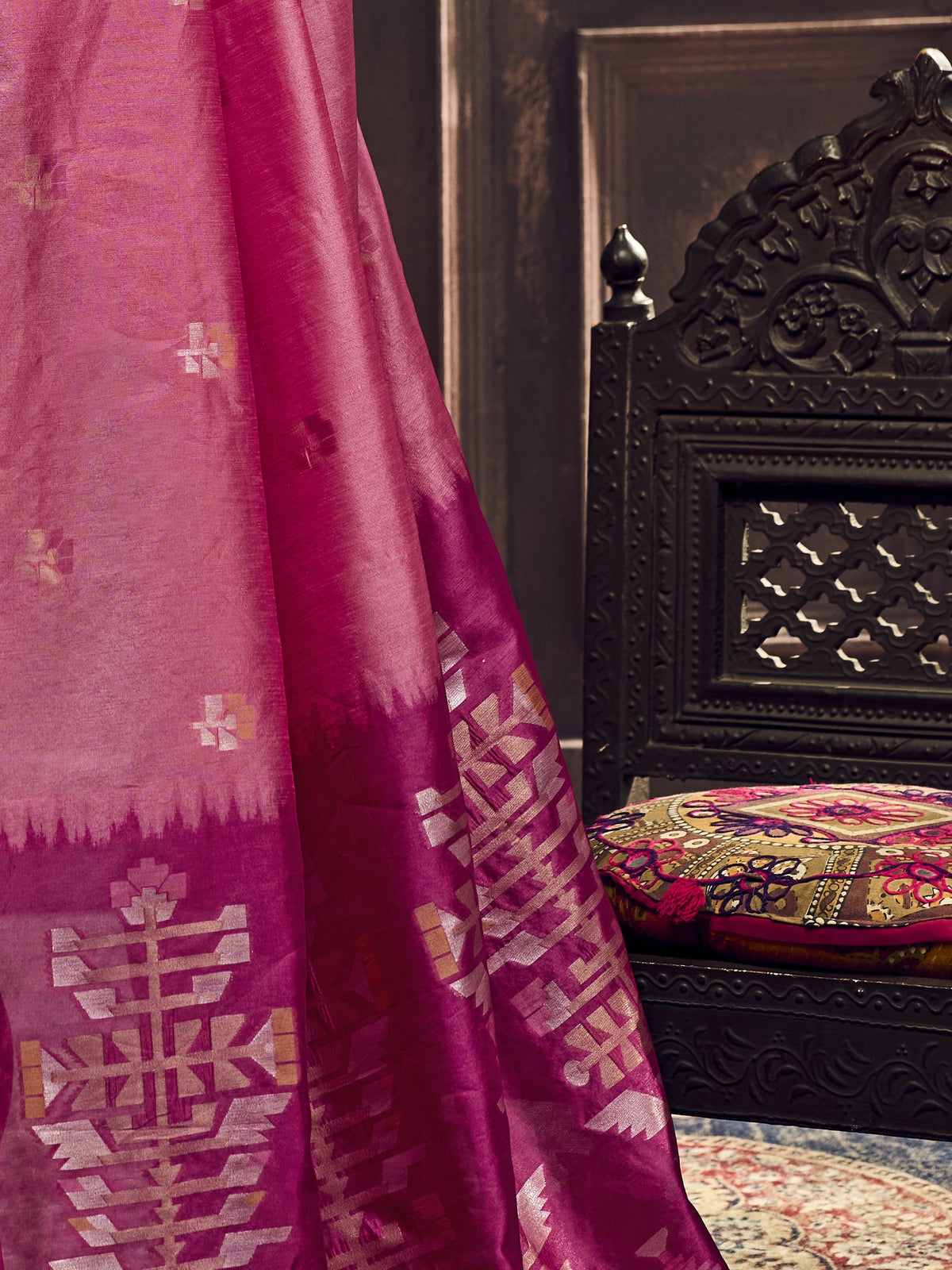 Pallu detail of pink silk blend saree showing zari butta (metallic motif) work and zari border