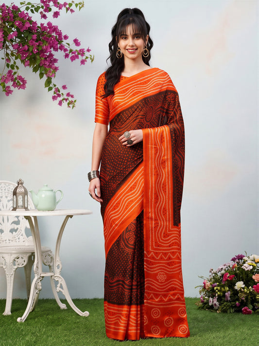 Woman wearing brown satin silk saree with bandhani tie-dye dot work and orange blouse