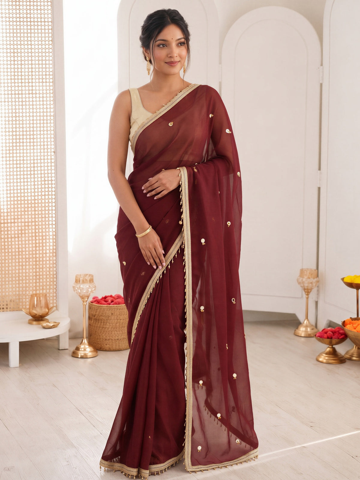 Maroon embellished poly georgette saree with gold blouse piece