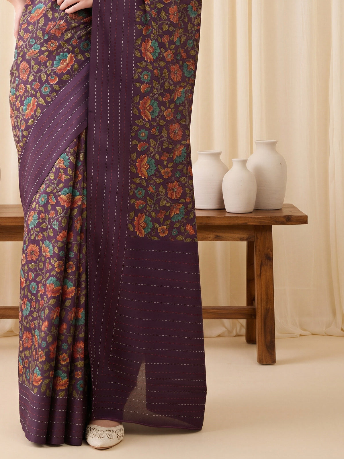 Pallu detail of purple silk blend saree showing kalamkari narrative motif work and embellished border