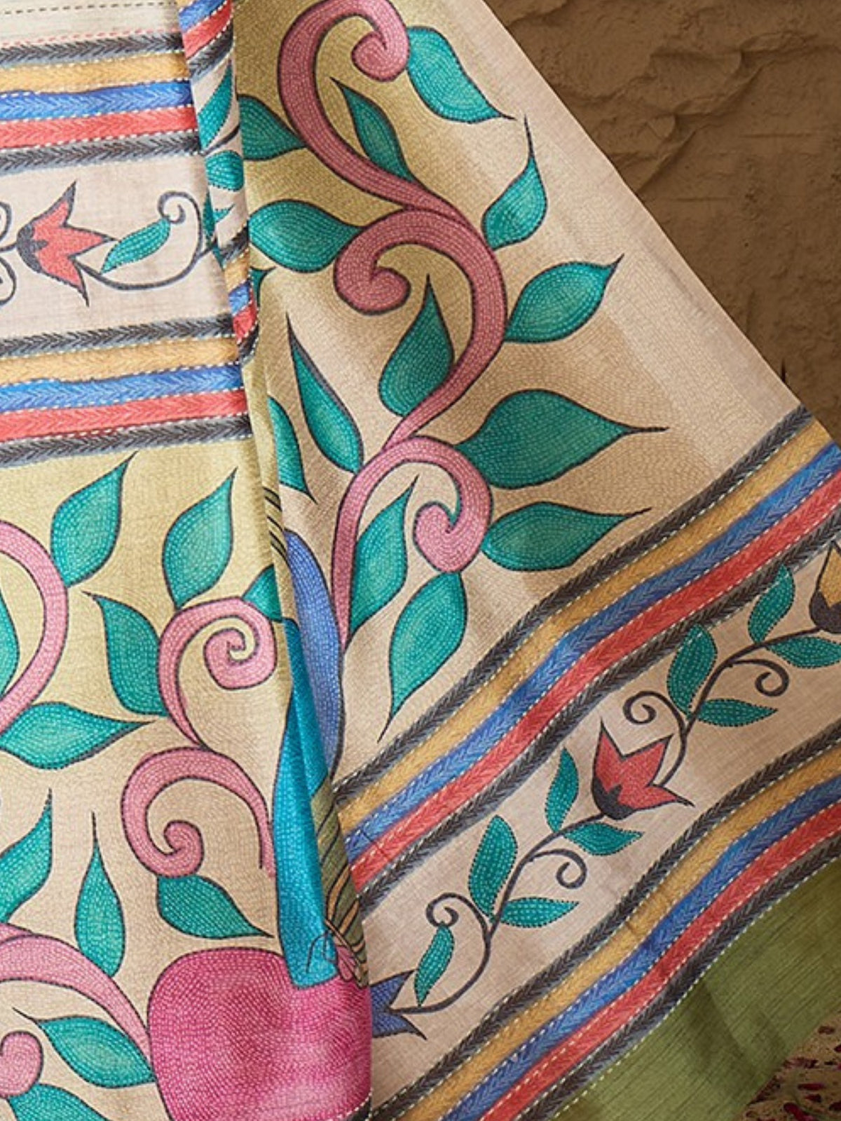 Pallu detail of multicolored art silk saree showing kalamkari narrative motif work and printed border