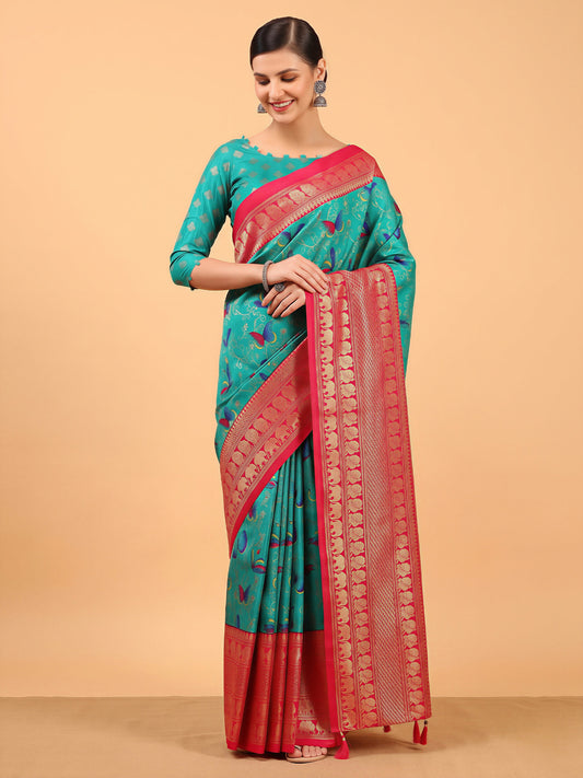 Woman wearing aqua blue cotton blend saree with butterfly motif design and red blouse