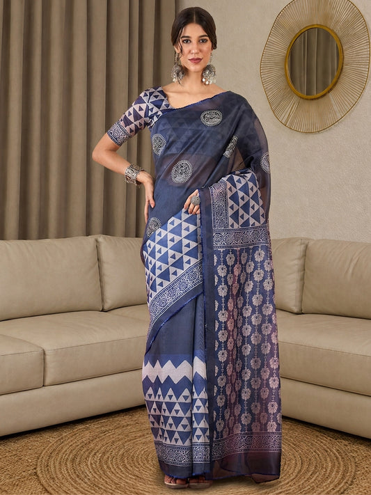Woman wearing indigo silk blend saree with all-over floral design and indigo blouse
