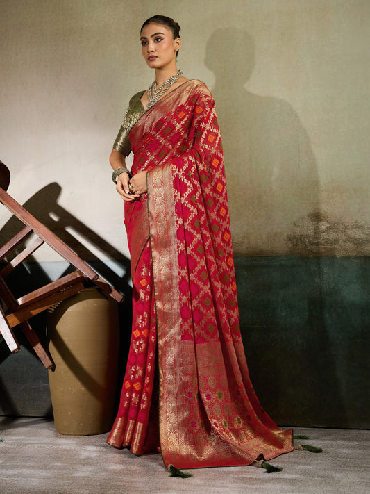 Woman wearing red georgette saree with woven motif design and red blouse