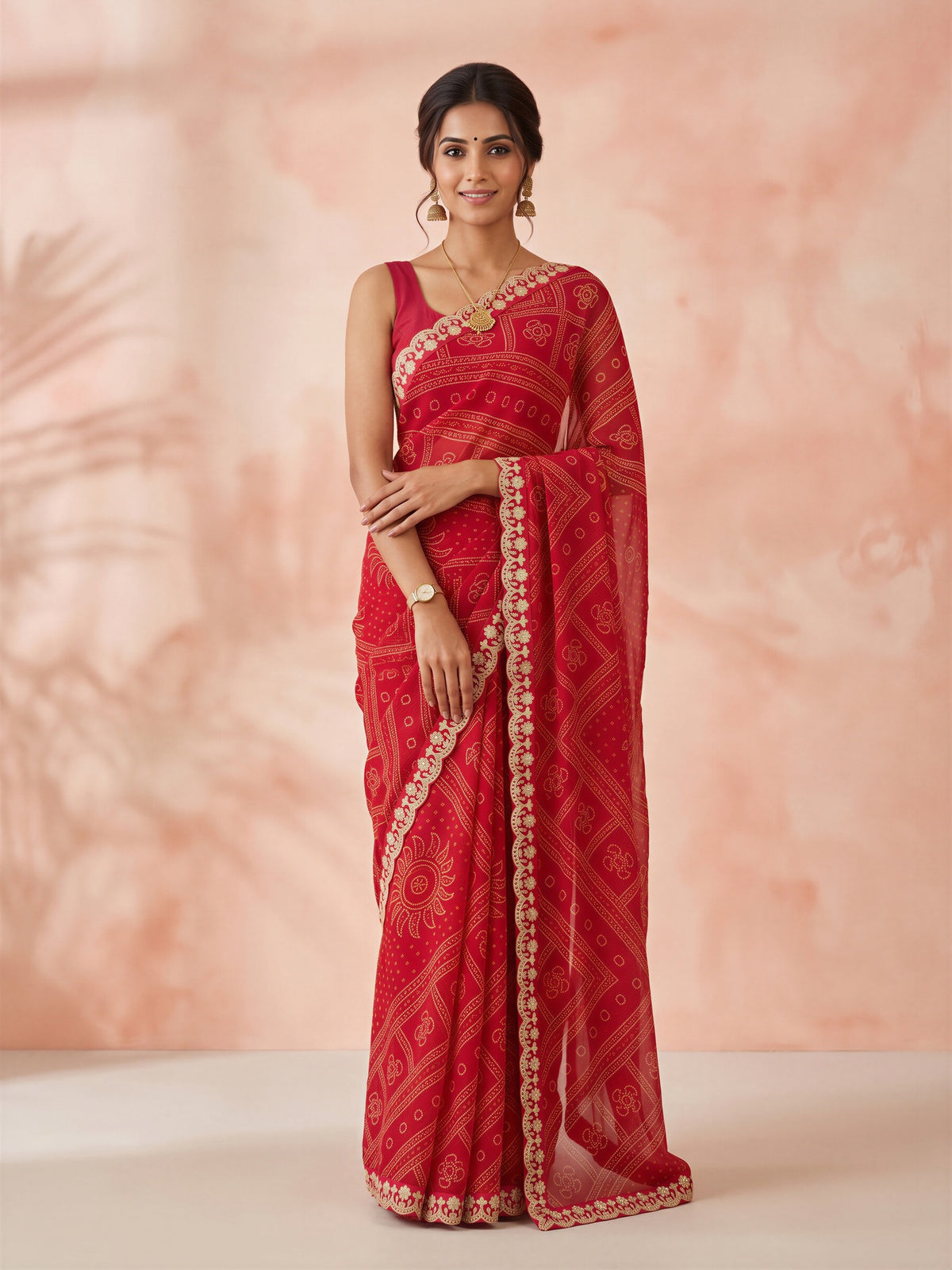 Woman wearing red georgette saree with bandhani tie-dye dot work and magenta blouse