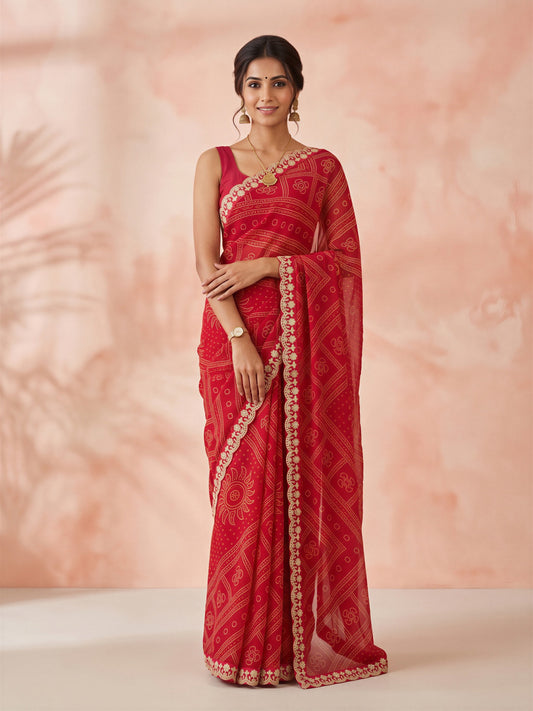 Woman wearing red georgette saree with bandhani tie-dye dot work and magenta blouse