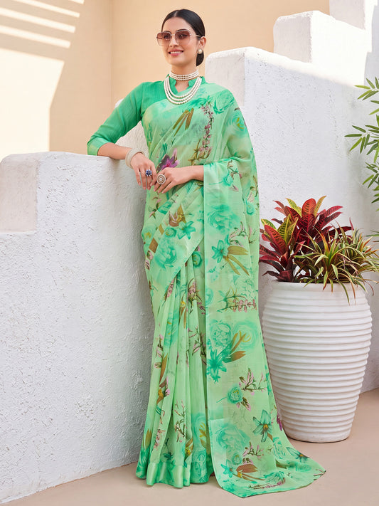 Woman wearing mint green cotton blend saree with floral print design and mint green blouse