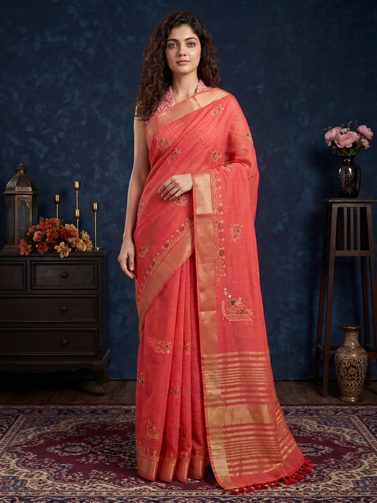 Woman wearing peach cotton linen saree with embroidered motif work and peach blouse