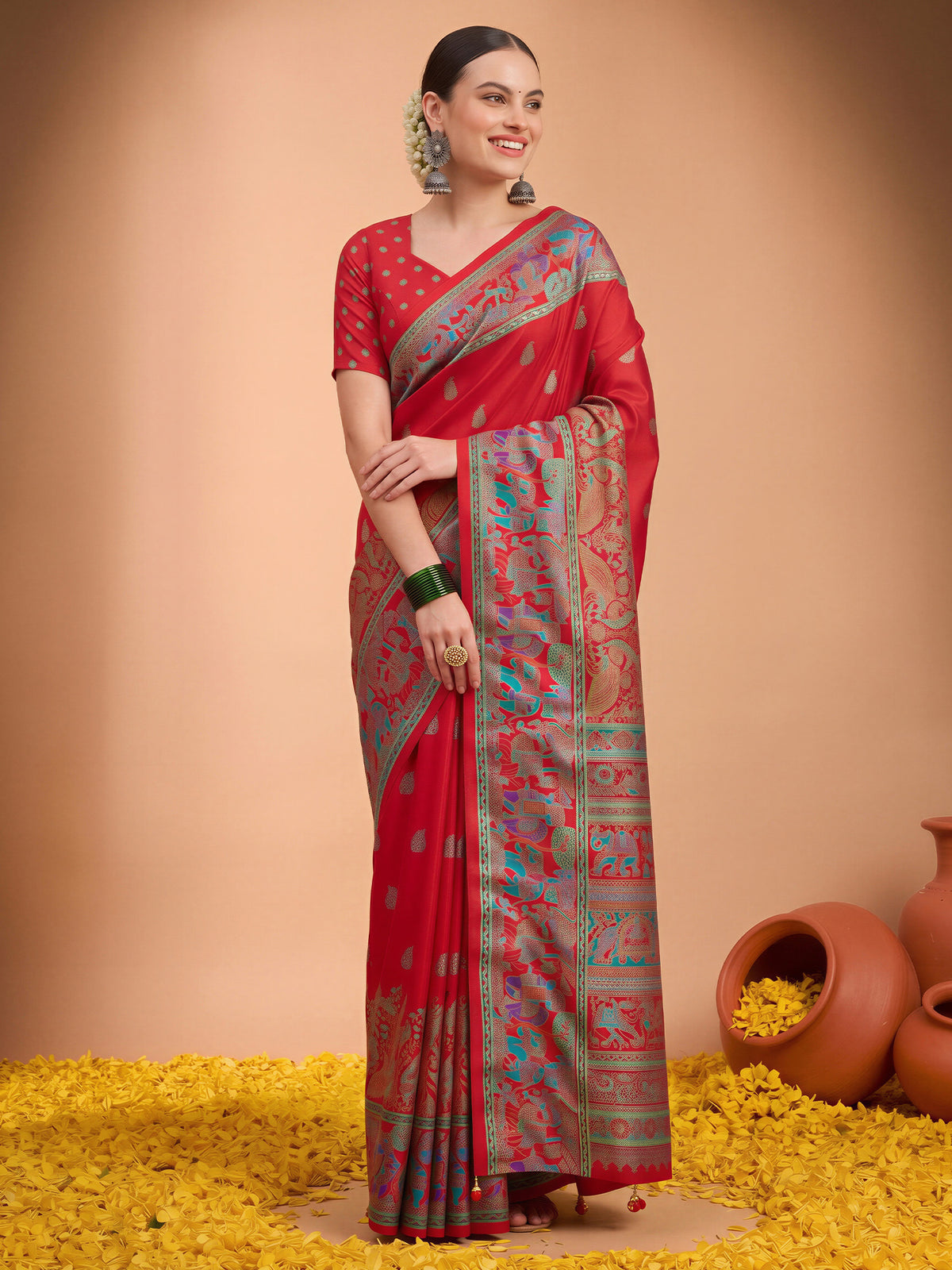 Woman wearing red silk blend saree with metallic foil print work and red blouse