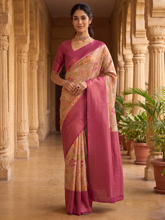 Woman wearing beige silk blend saree with all-over floral design and pink blouse