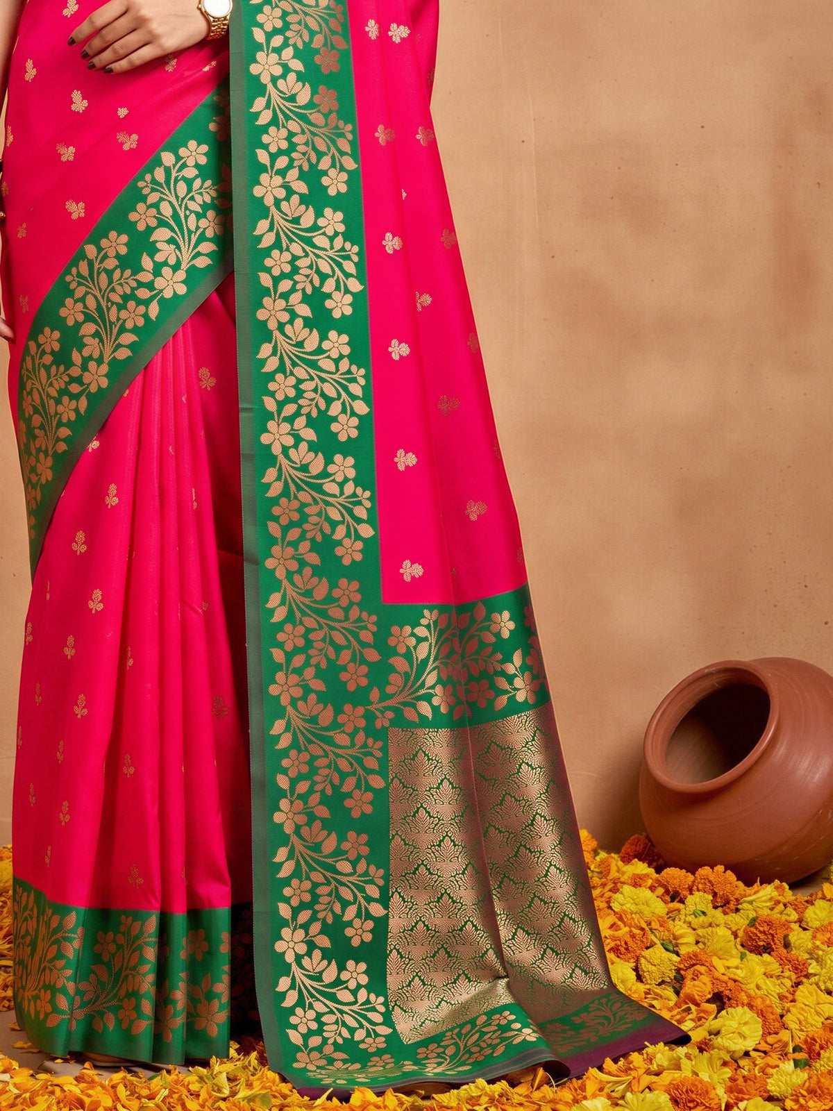 Pallu detail of pink cotton blend saree showing all-over floral design and zari border