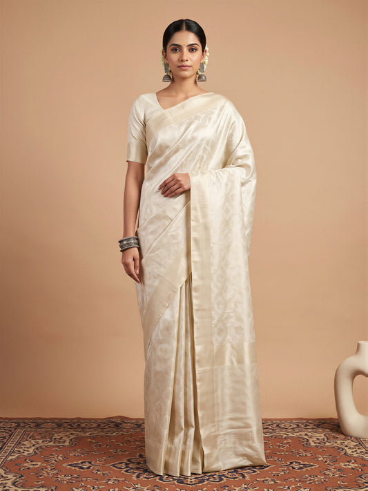 Woman wearing off white silk blend saree with woven motif design and off white blouse