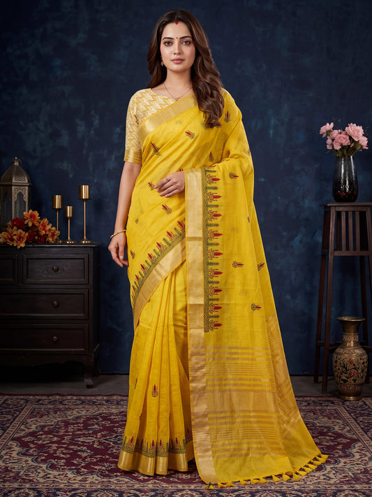Woman wearing yellow cotton linen saree with embroidered motif work and yellow blouse