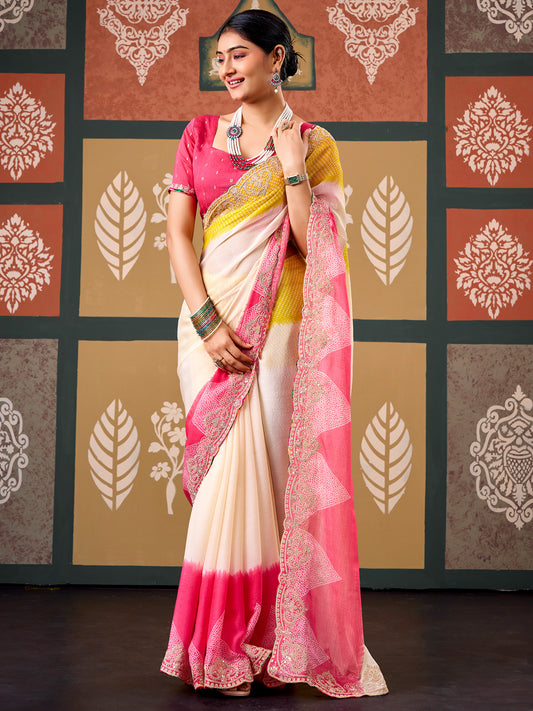 Woman wearing cream chiffon saree with bandhani tie-dye dot work and pink blouse