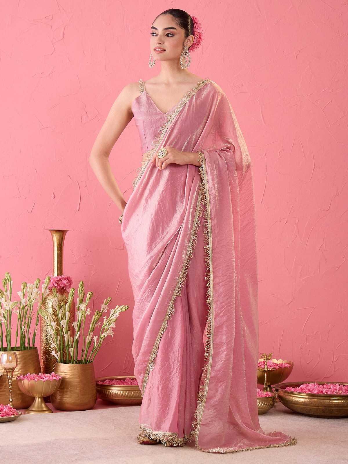 Woman wearing mauve paper silk ready to wear saree with ornamented surface design and mauve blouse