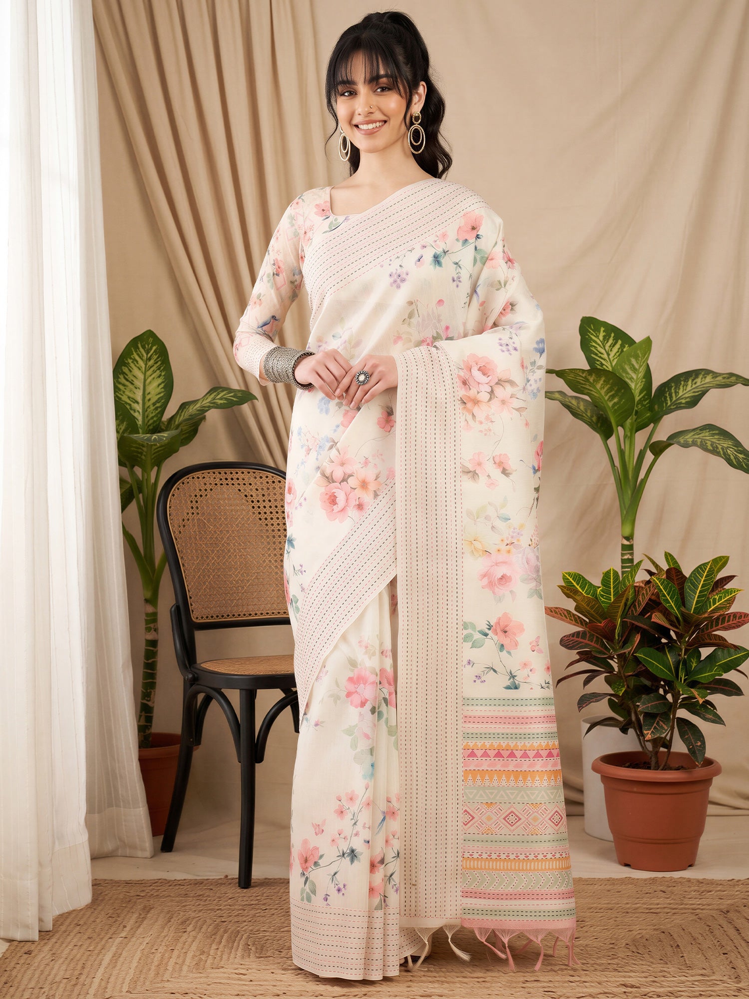 Woman wearing off white silk cotton saree with botanical floral and leaf design and off white blouse