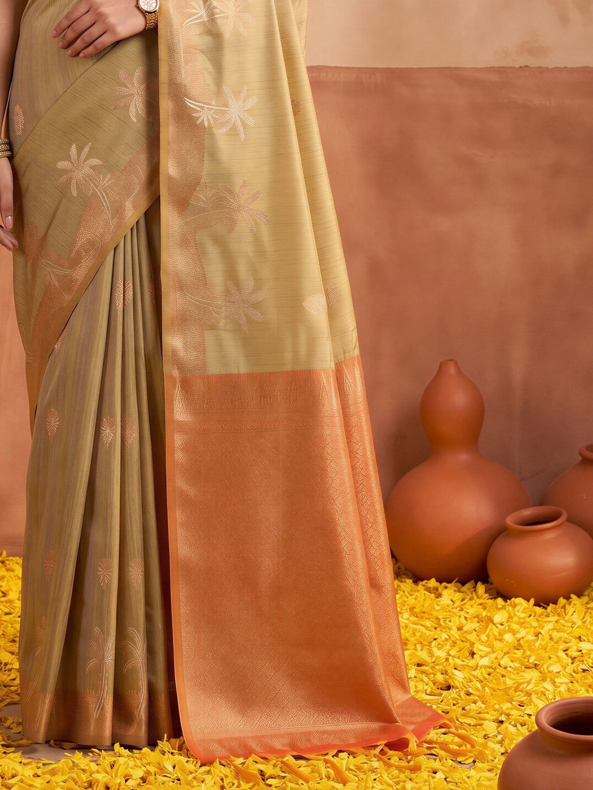 Pallu detail of beige tussar silk saree showing traditional indian motif work and zari border