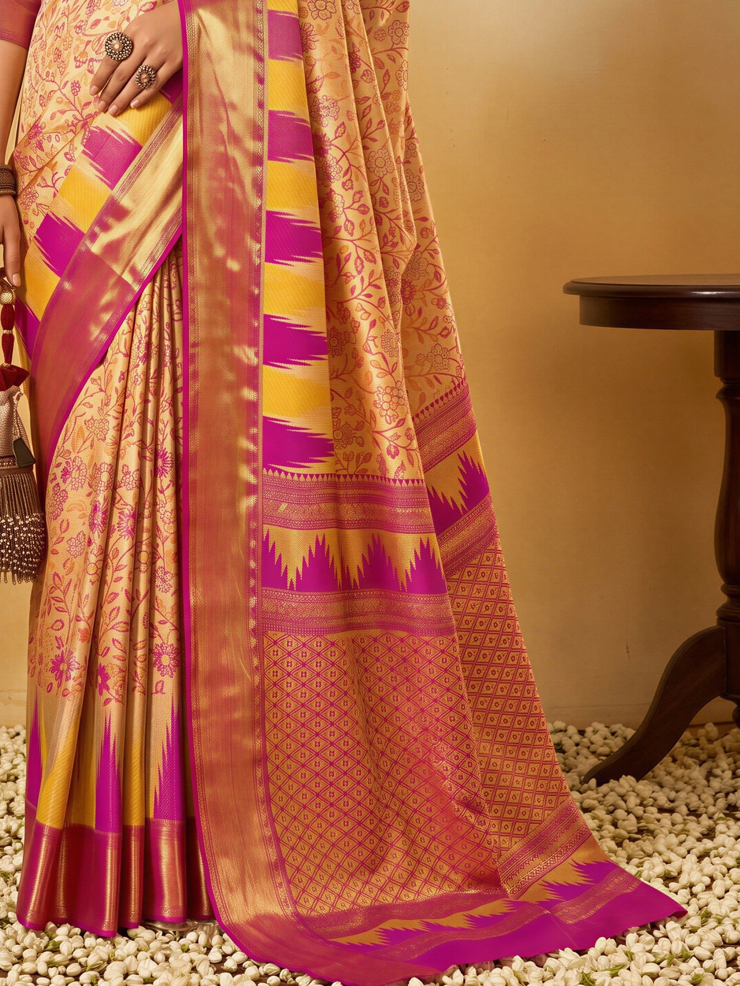 Pallu detail of beige silk blend saree showing traditional indian motif work and zari border