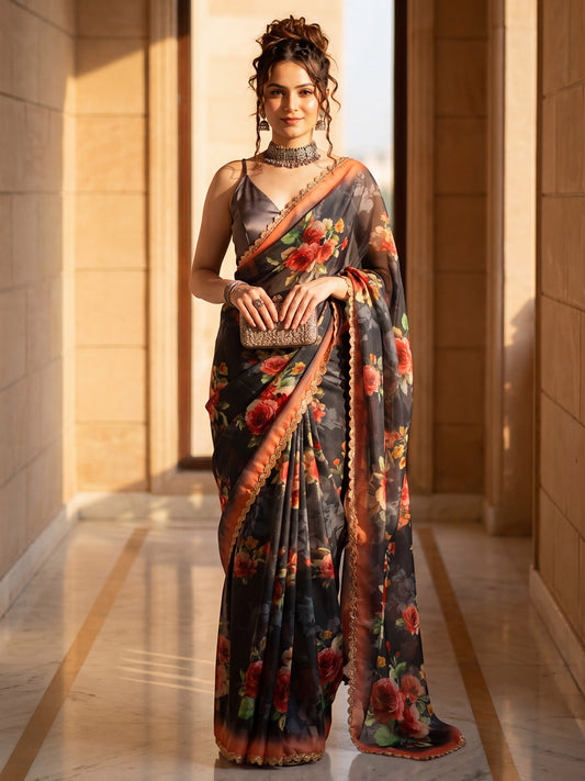 Woman wearing charcoal grey organza saree with all-over floral design and charcoal grey blouse