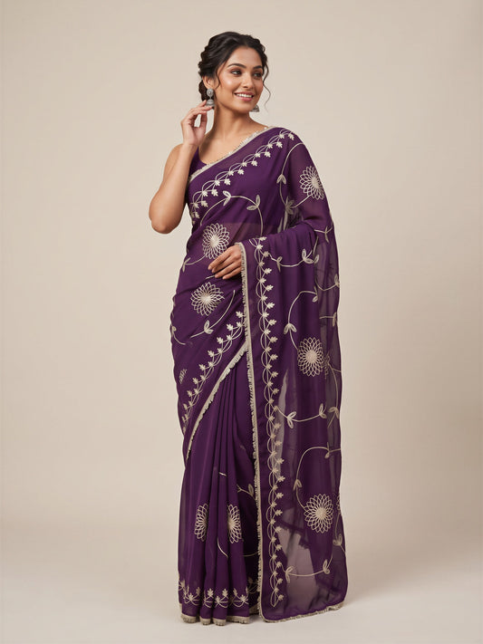 Woman wearing wine georgette saree with embroidered motif work and wine blouse