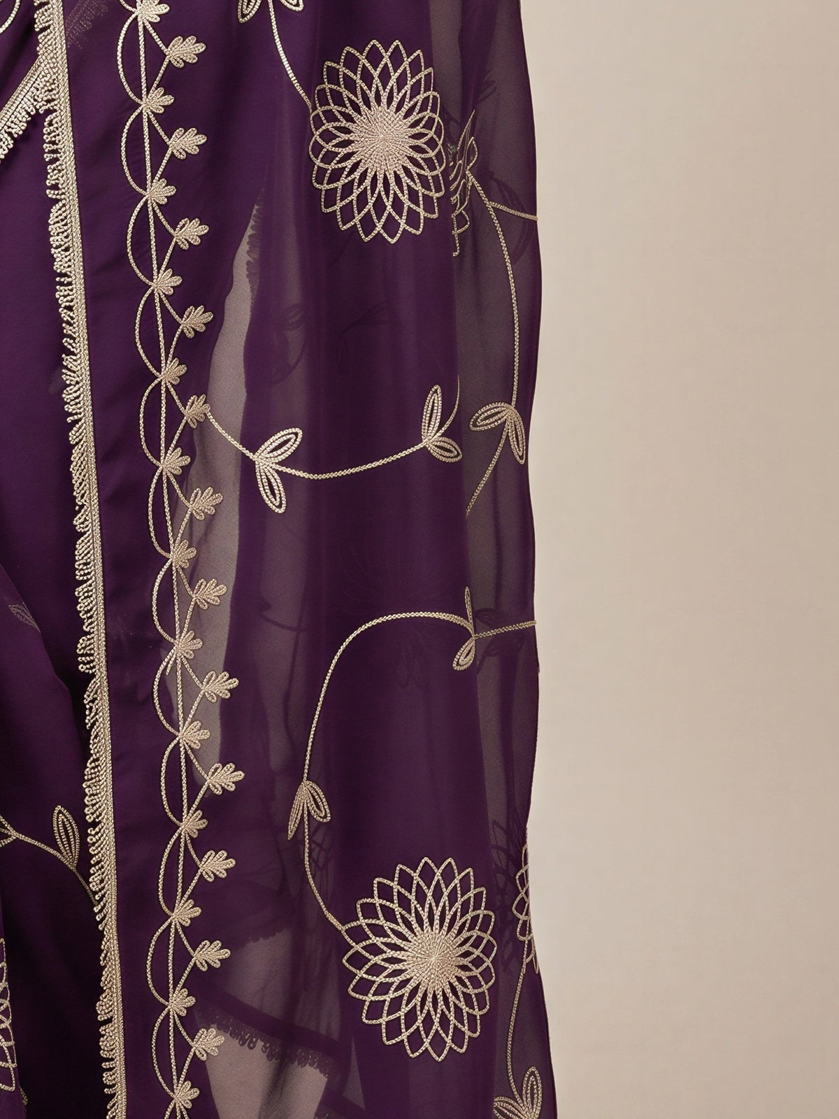 Pallu detail of wine georgette saree showing embroidered motif work and embellished border