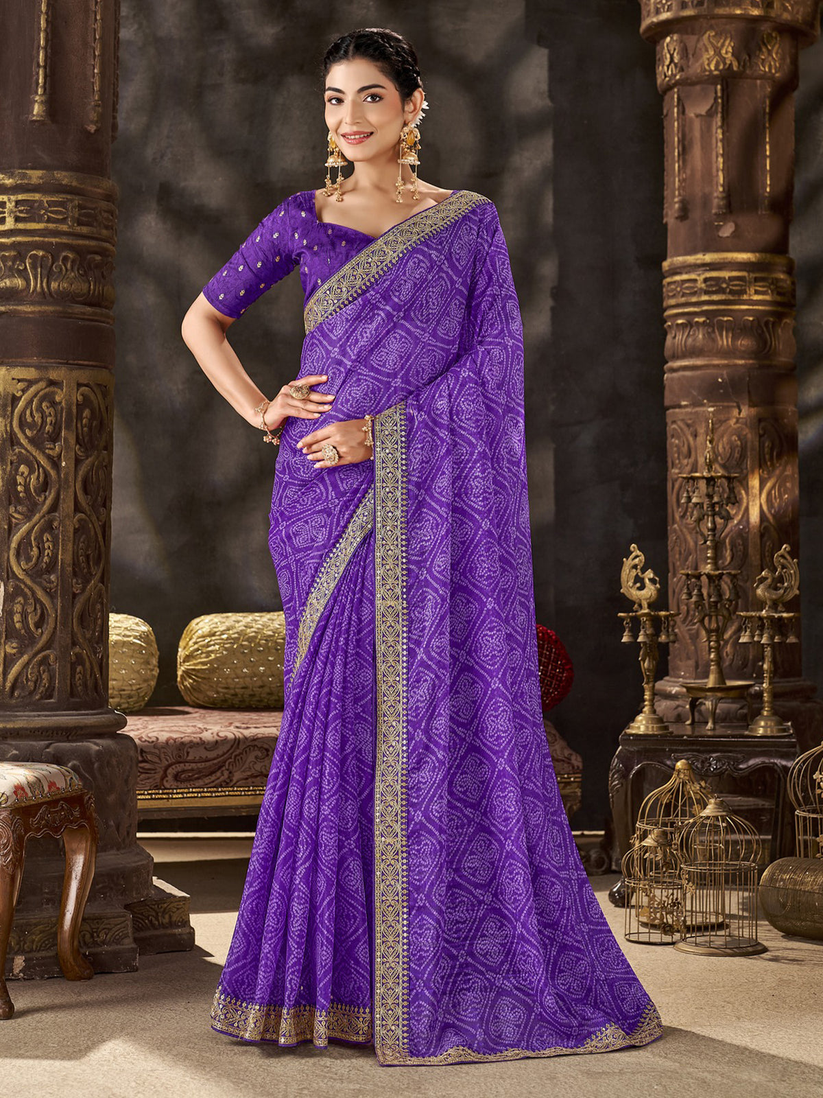 Woman wearing purple chiffon saree with bandhani tie-dye dot work and purple blouse