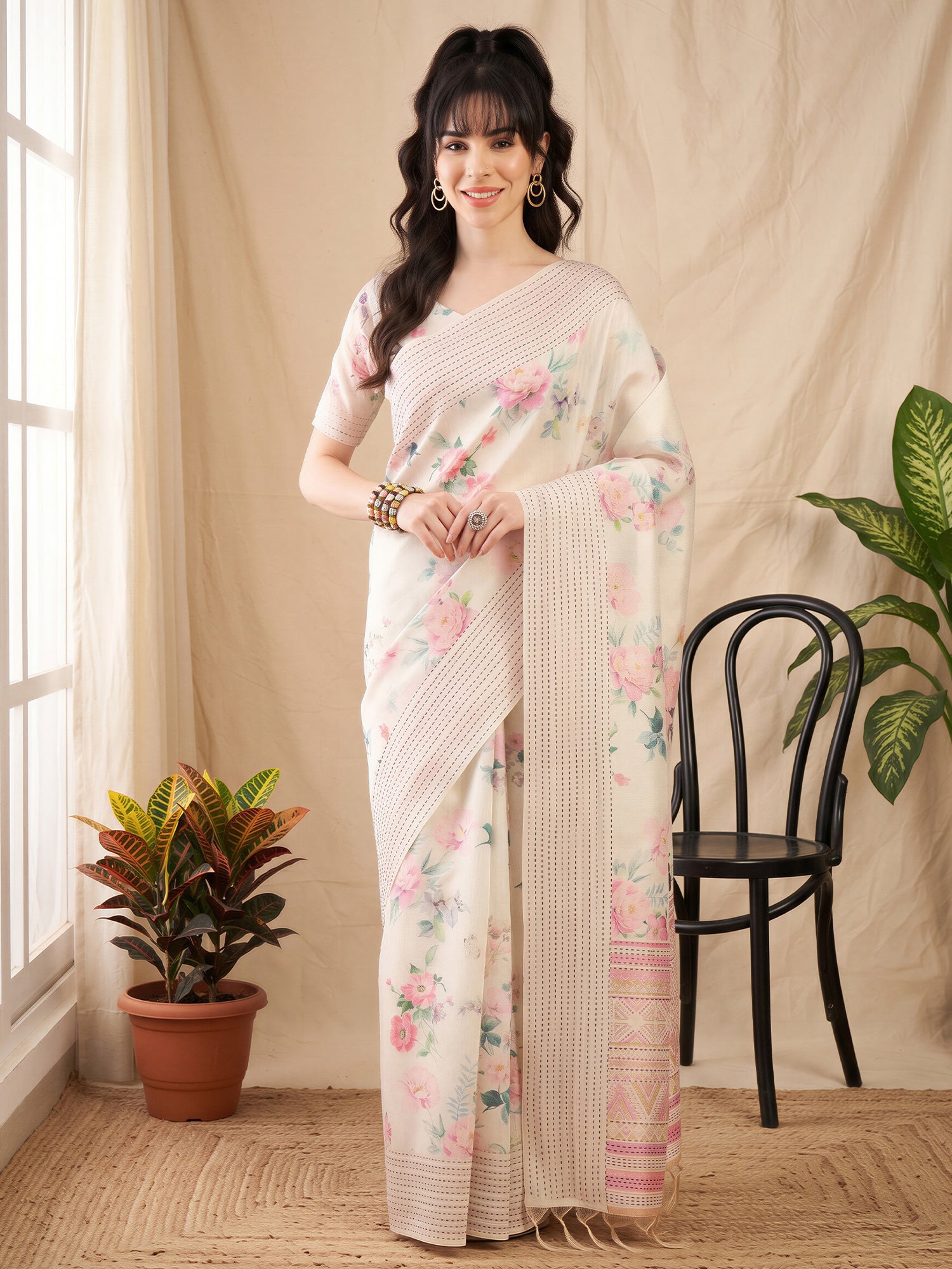 Woman wearing off white silk cotton saree with botanical floral and leaf design and off white blouse