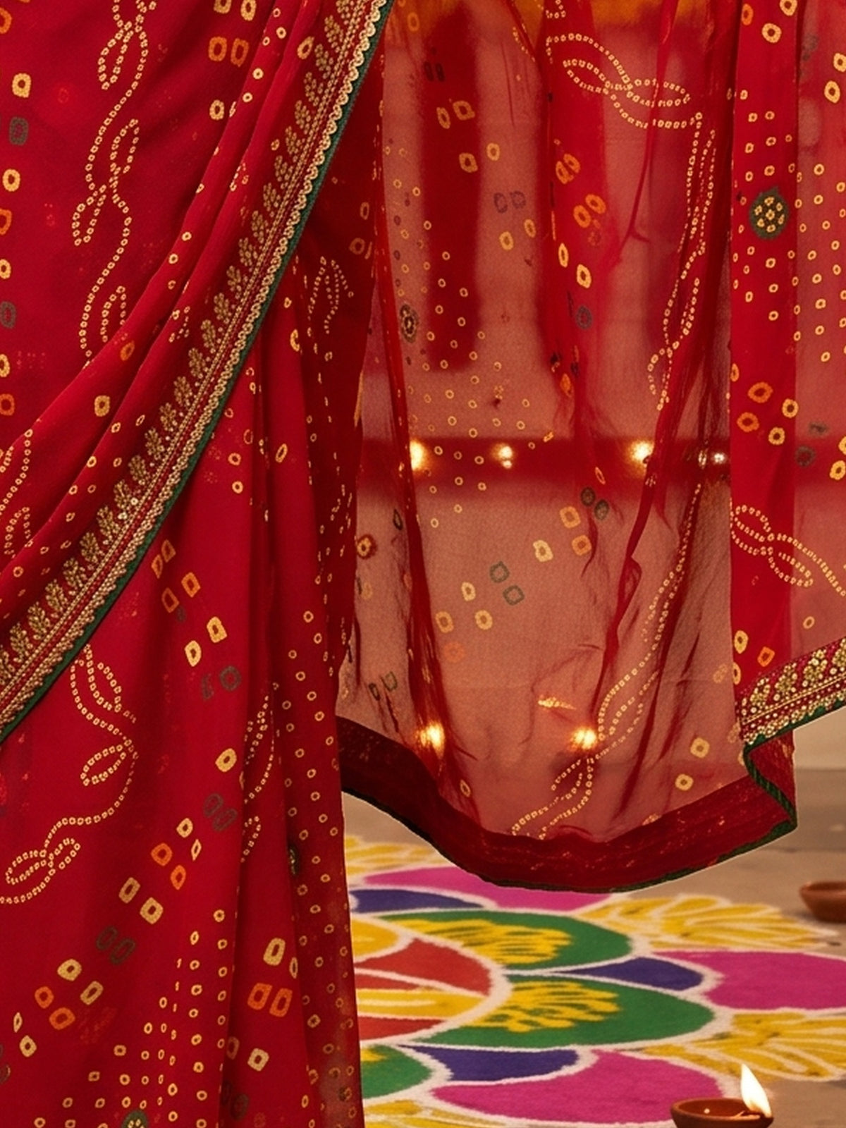 Pallu detail of red georgette saree showing bandhani tie-dye dot work and zari border