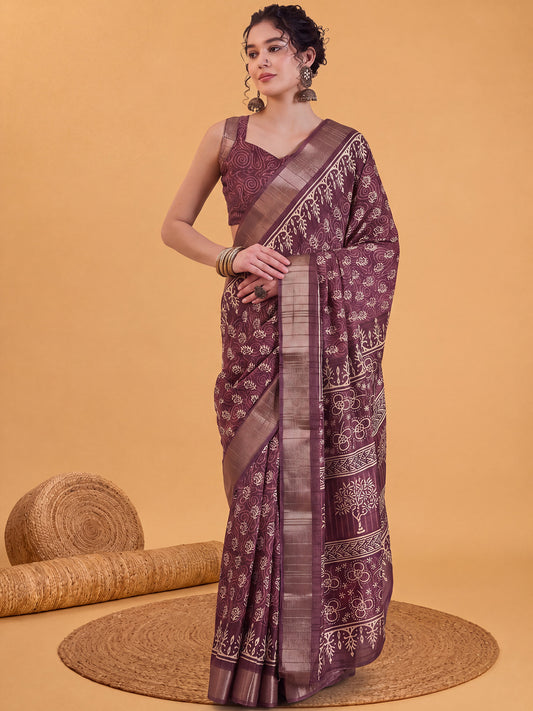Woman wearing burgundy silk blend saree with dabu mud-resist print work and burgundy blouse