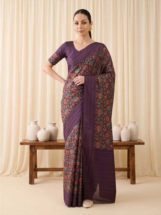 Woman wearing purple silk blend saree with kalamkari narrative motif work and purple blouse