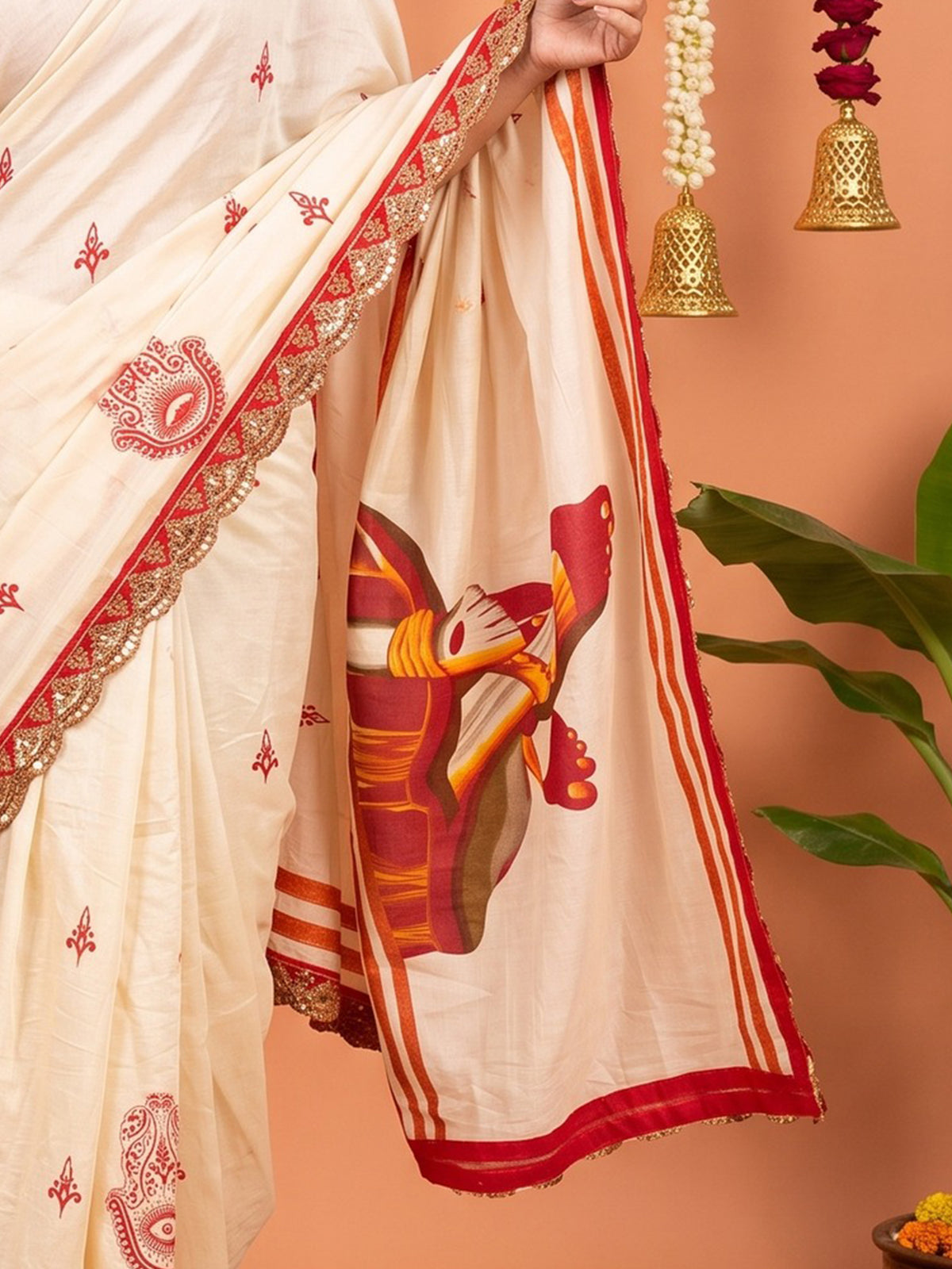 Pallu detail of off white cotton saree showing traditional indian motif work and embellished border