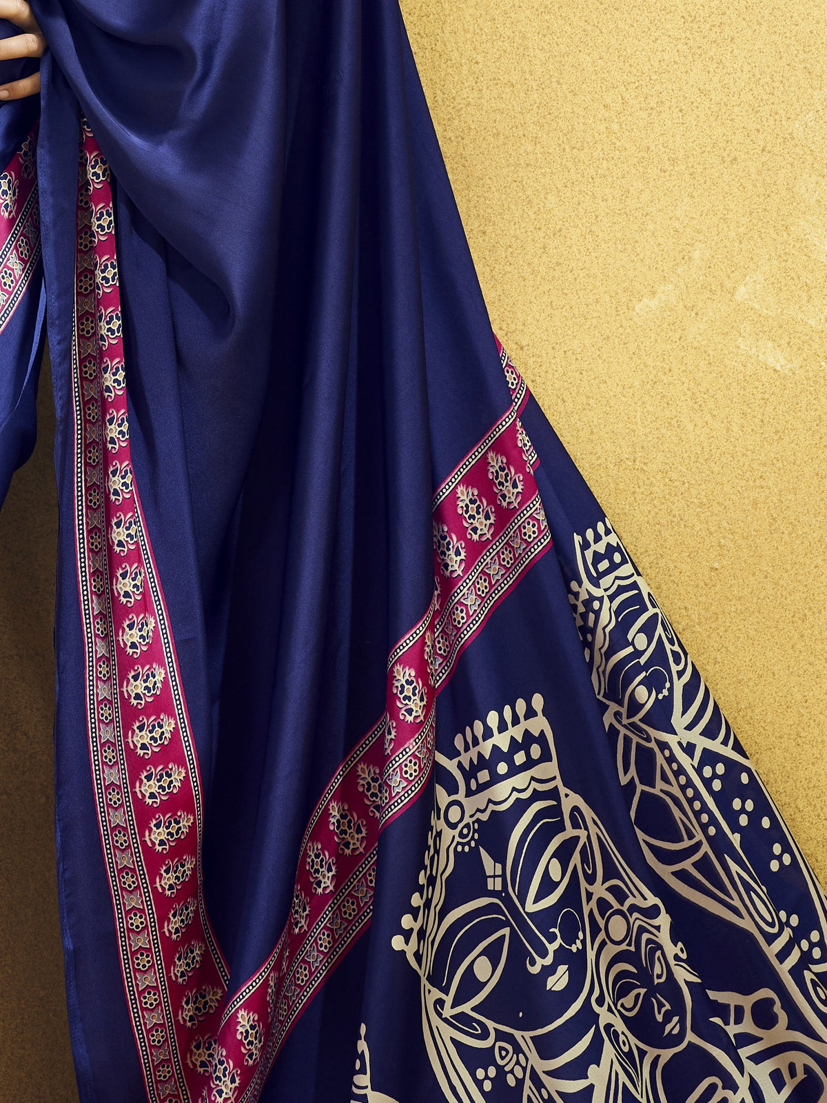 Pallu detail of navy blue satin saree showing ajrak block-print motif work and printed border