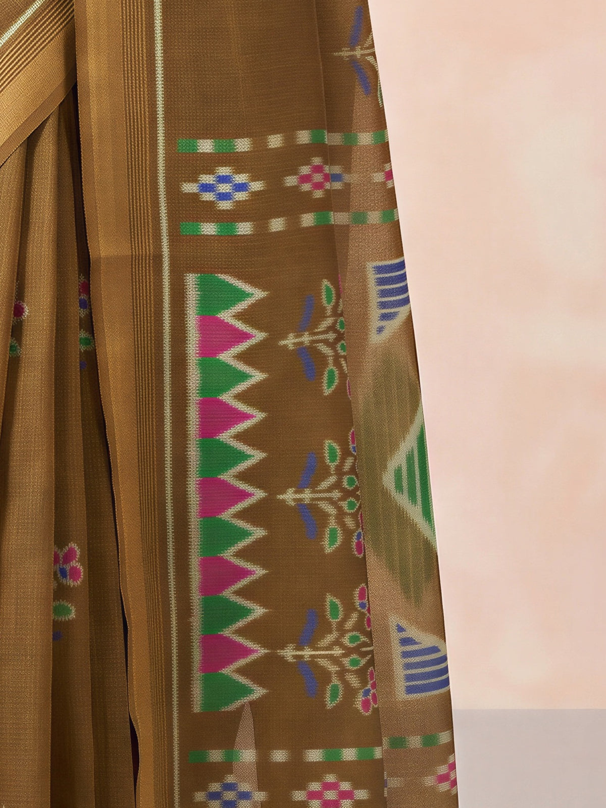 Pallu detail of olive cotton linen saree showing traditional indian motif work and zari border