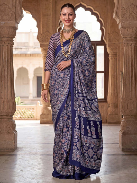 Woman wearing navy blue crepe saree with ajrak block-print motif work and navy blue blouse